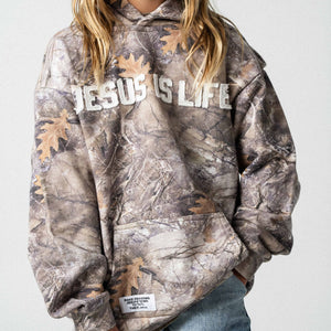 front of youth camouflage cotton french terry hoodies with applique letters that read Jesus is the way the truth and the life